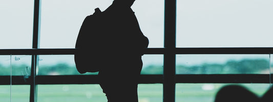 Traveler with a backpack at an airport terminal