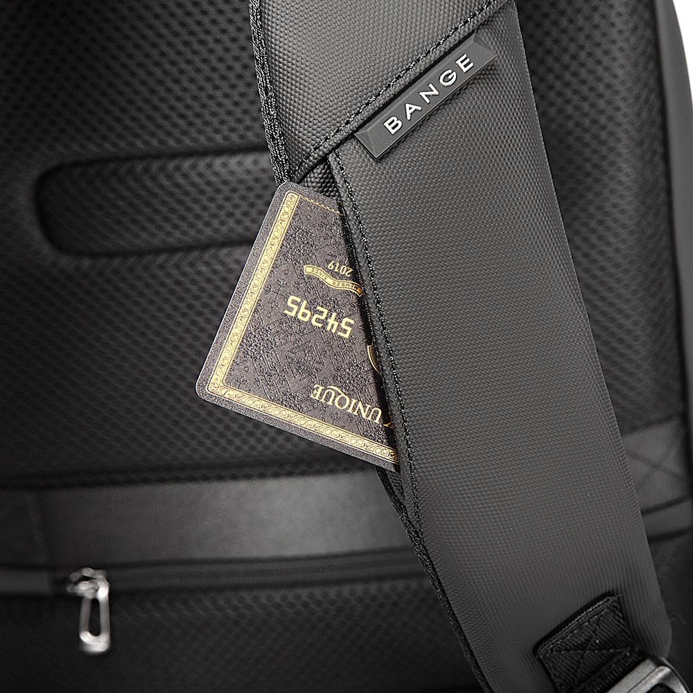Close-up of BANGE backpack shoulder strap with hidden card pocket holding a credit or transit card.