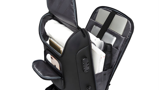 BANGE 7216 Plus backpack with its top compartment and front pocket open, holding a phone, clothes and a laptop
