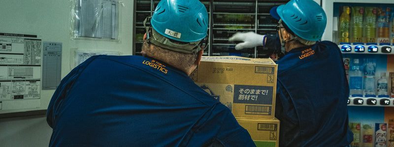 Warehouse team handling shipping boxes
