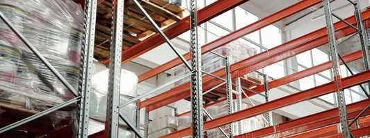 Stacked pallets of stock in a warehouse