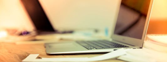 Laptop, notebook and tech accessories on a desk