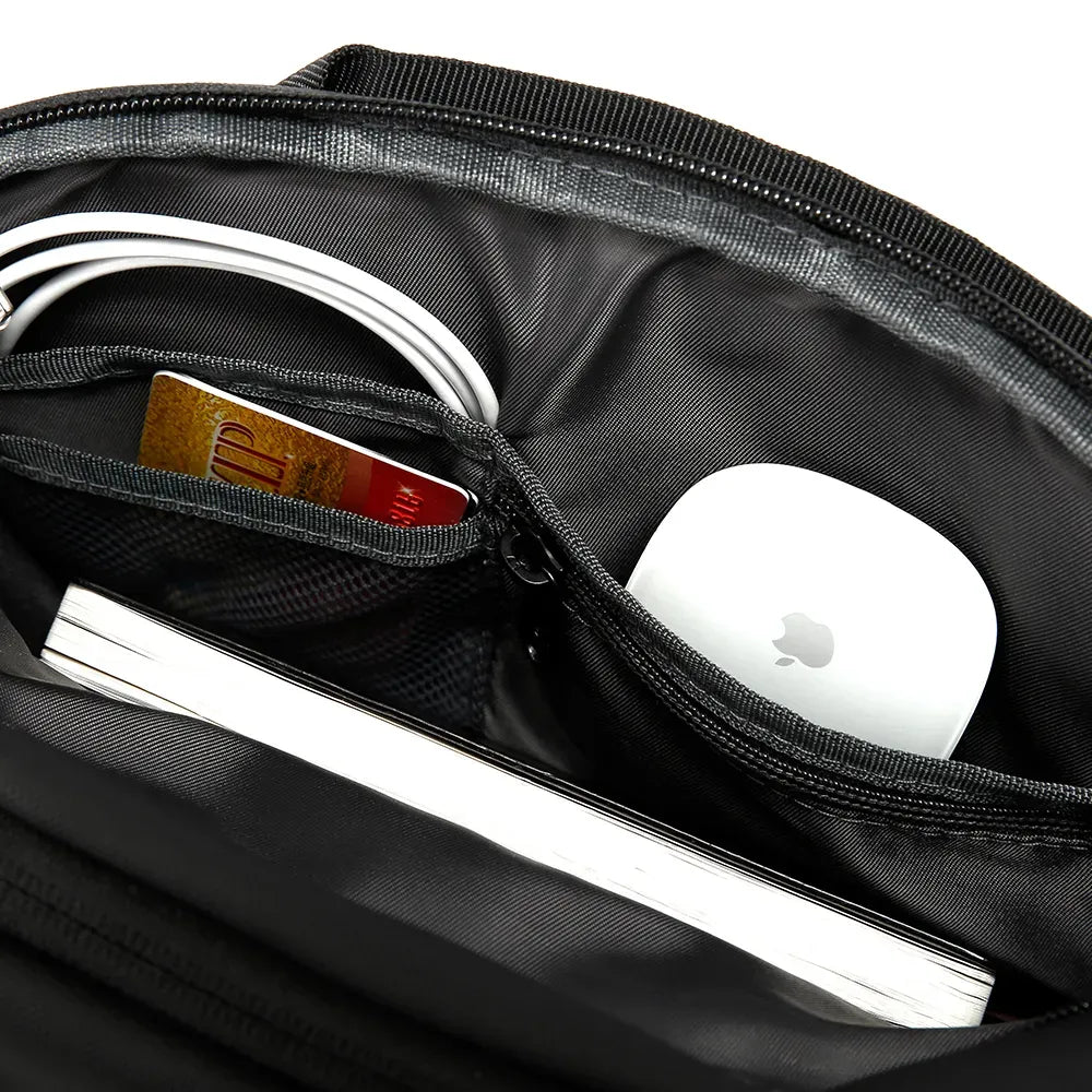 Opening the Syren BANGE BG-7717 reveals multiple compartments for essentials like phones, wallets, and keys, keeping everything organized on the go