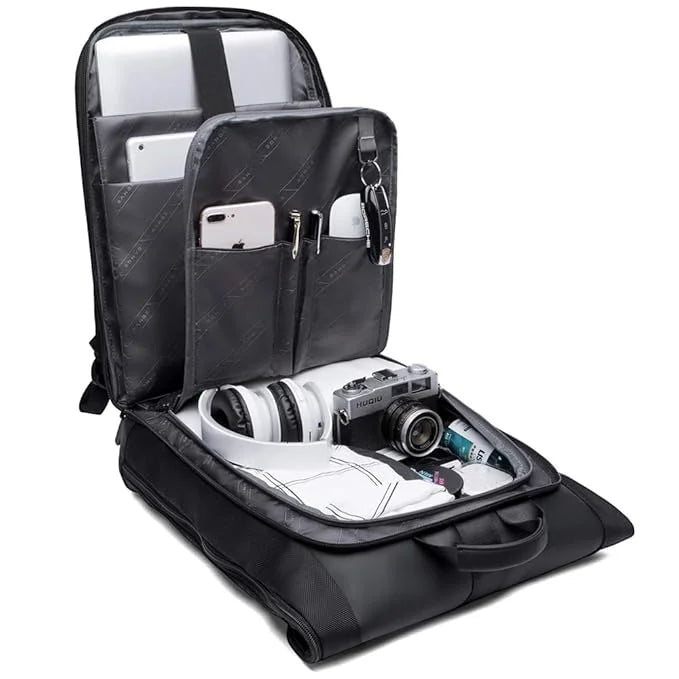 BANGE backpack shown fully opened with organized compartments holding a laptop, camera, headphones, and accessories on a white background