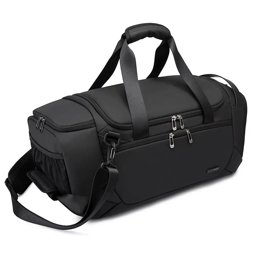 Angled view of the BANGE BG-2378 black duffel bag featuring multiple zippered compartments, reinforced top handles, and an adjustable shoulder strap on a white background