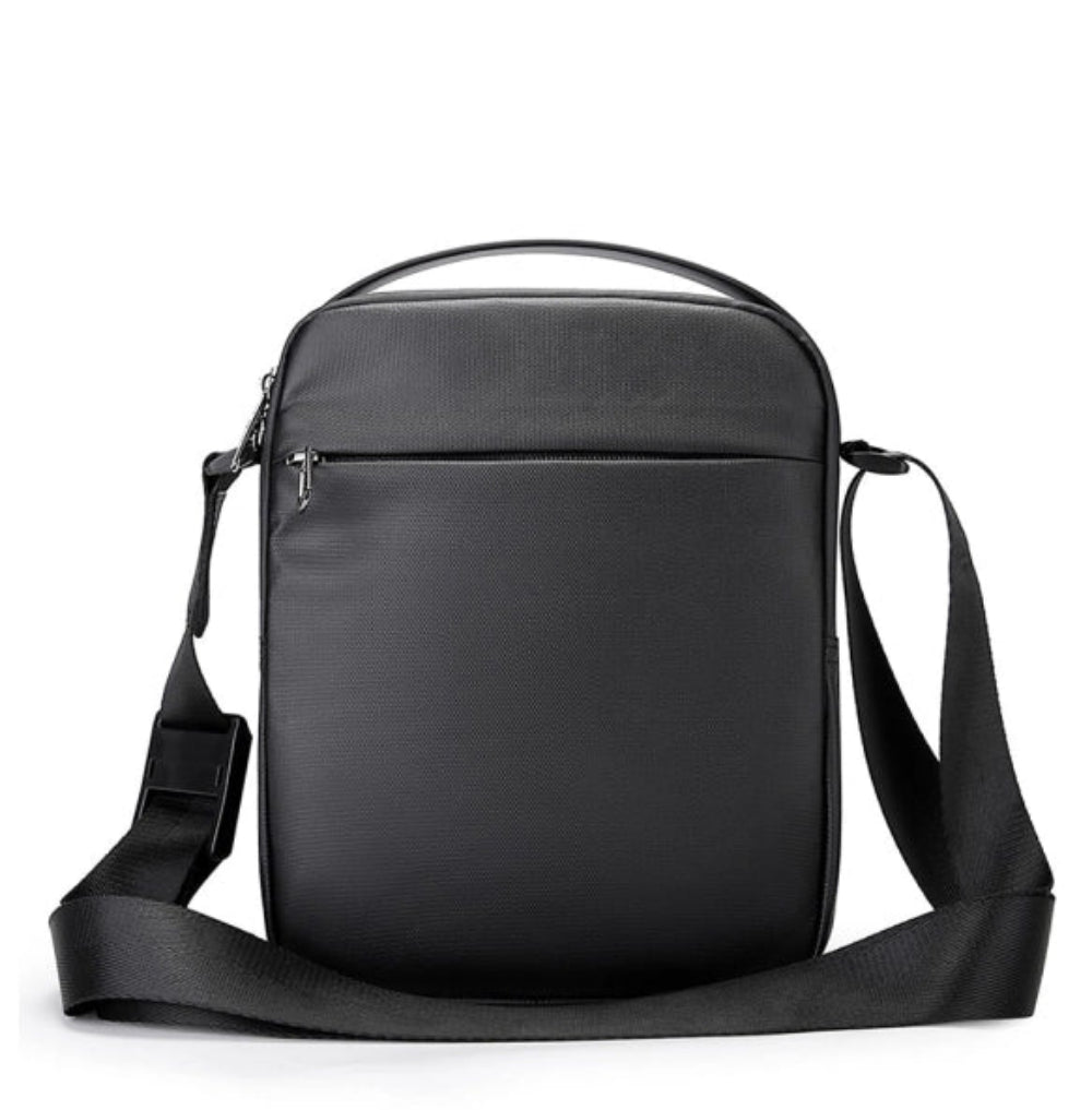 Front view of the BANGE BG-2876 anti-theft crossbody shoulder bag with slim profile, zippered front pocket, adjustable strap, and minimalist BANGE branding on a white background