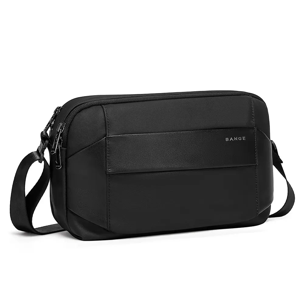 Angled view of black BANGE BG-7717 Syren crossbody bag with compact rectangular shape, front pocket panel, and adjustable shoulder strap