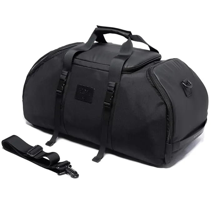 Angled view of a black BANGE duffel bag featuring carry handles, adjustable straps, and a spacious main compartment on a white background