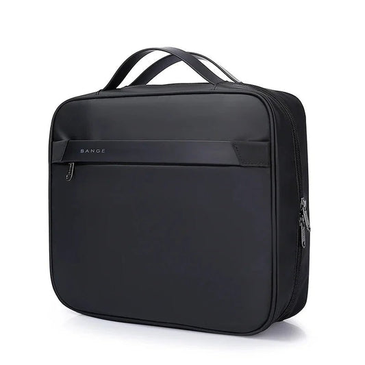 Front view of black BANGE travel garment bag with square structured design, top carry handles, and front zip pocket
